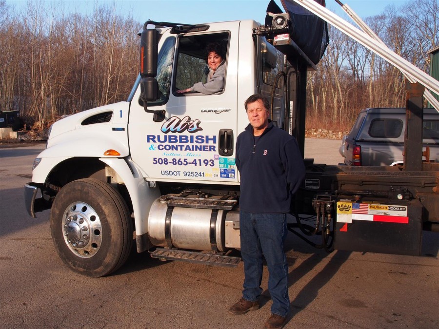 Al Gerard and one of his many rubbish removal trucks